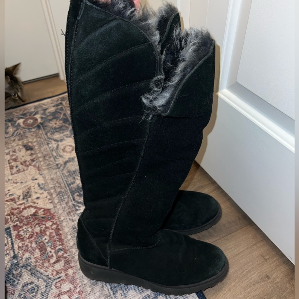 Tall black Ugg Rosalind waterproof suede boot. Inner faux fur lined.